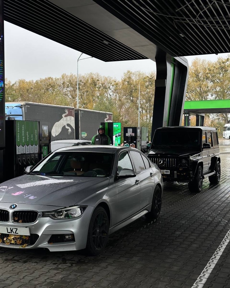 BMW and a G-Wagen at the gas station